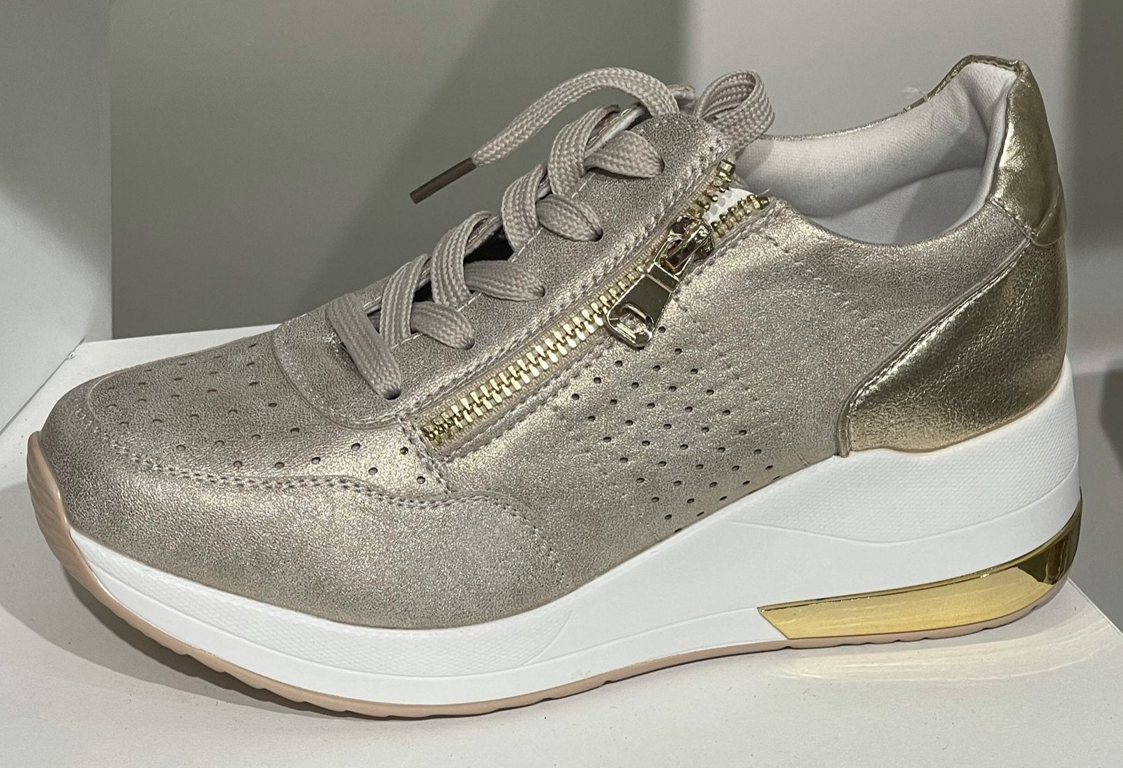 Buy Gold Metallic Sneaker Wedges by Tiesta Online at Aza Fashions.